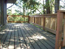 Deck with stairs leading down to first floor